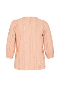 Peach-colored blouse with three-quarter sleeves, featuring embroidered detailing with cut-out patterns, textured fabric, and a relaxed fit.