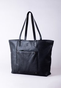Black leather tote bag featuring two long handles, a front pocket with brass accents, and a textured surface. Simple rectangular design.
