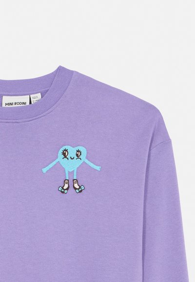 Purple sweatshirt with a small blue heart character wearing roller skates embroidered on the chest near the neckline.