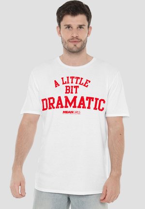 White cotton T-shirt featuring bold red lettering that reads "A LITTLE BIT DRAMATIC" with "MEAN GIRLS" logo underneath. Short sleeves, relaxed fit.