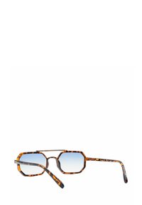 Occhiali da sole a forma di ottagono in tartaruga con lenti graduali; montatura sottile e slanciata; bracci leggermente flessibili; motivo colorato distintivo con accenti scuri.