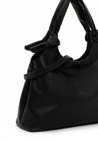Black leather handbag with a textured finish, structured shape, and knotted handles. Features minimal hardware and a logo on the bottom.