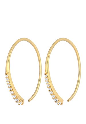 Boucles d'oreilles créoles ouvertes ton or avec une rangée de petits cristaux clairs le long d'un côté, incurvées et effilées aux extrémités.