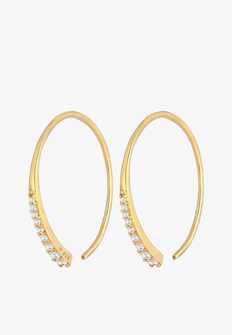 Boucles d'oreilles créoles ouvertes ton or avec une rangée de petits cristaux clairs le long d'un côté, incurvées et effilées aux extrémités.