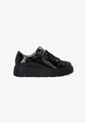 Black patent leather sneakers with round toe, thick black rubber sole, lace-up design, metallic accents, and smooth glossy finish.