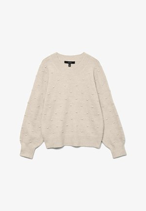 Beige strikket sweater med rund halsudskæring. Der er hævede prikkemønstre over det hele samt ribbede manchetter og kant. Blød tekstur, afslappet pasform.