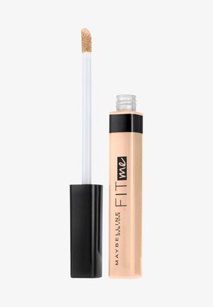 Beige flydende concealer i en gennemsigtig tube med en sort hætte. Har en doe-foot applikator for præcis påføring. "FIT me" logoet er vist.