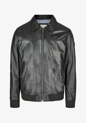 Melna ādas jaka ar rāvējslēdzēju priekšpusē, norādītu apkakli un ribotām piedurknēm. Piedāvā divas sānu kabatas un gludu tekstūru.