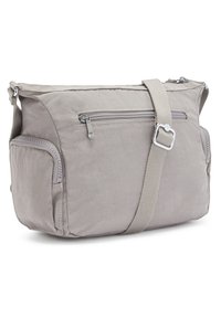 Borsa a spalla in nylon grigio con una singola tracolla regolabile, tasca frontale con zip, tasca laterale e superficie liscia. Presenta un design leggero.
