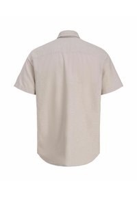 Chemise décontractée beige à manches courtes avec col, vue de dos sur fond blanc.