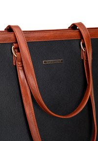 Black fabric tote bag with brown leather straps, featuring a gold logo plate. Design includes a smooth texture and structured shape.