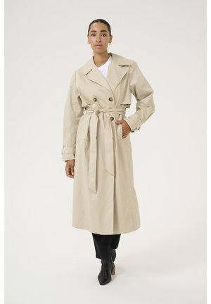 Helebeige trench coat kahe ridadega, laia kraega ja sobiva vööga. Omab esipakke ja põlvikuni ulatuvat lõiget.