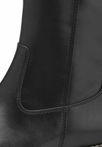Black leather ankle boot featuring a smooth texture, subtle stitching details, and a rounded top with an elastic side panel for easy wear.