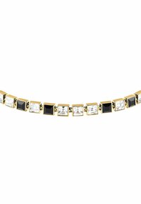 Collana in tonalità oro con pietre quadrate di vetro nero e trasparente alternate, caratterizzata da una catena in metallo lucido e un design geometrico.