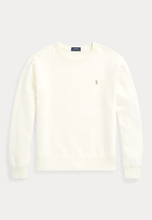 Sweatshirt creme feito de tecido macio. Apresenta um decote redondo, mangas compridas, punhos canelados e um pequeno logótipo bordado em ouro no peito.