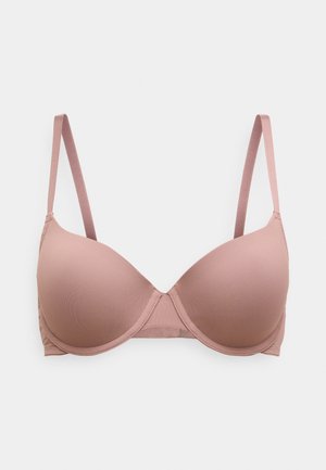 Reggiseno imbottito rosa chiaro con spalline regolabili, texture liscia e design senza cuciture. Include ferretto e pannelli laterali per supporto.