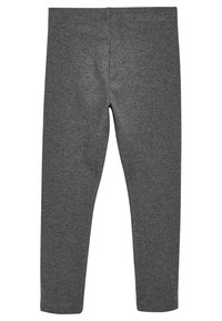 Harmaat legginsit, jotka on valmistettu pehmeästä ja joustavasta kankaasta, slim fit -leikkauksella. Ominaisuuksia ovat leveä vyötärönauha sekä ei näkyviä saumoja tai kuvioita.