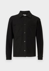 Black button-up shirt made from soft fabric, featuring a collar, two front pockets, and long sleeves with buttoned cuffs.