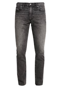 Jean en denim noir avec une finition délavée, design classique à cinq poches, coupe droite, et fermeture à bouton en métal à la taille.