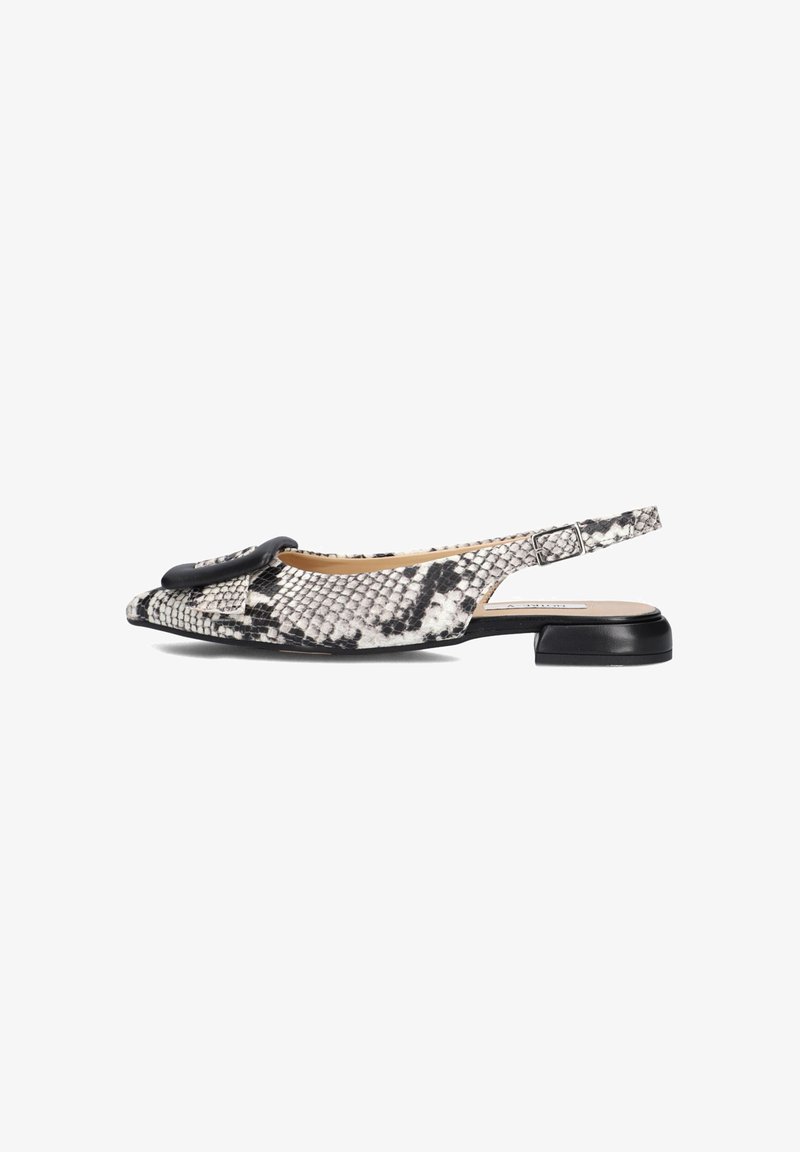 Slingback flat shoe with a black and white snakeskin pattern, round toe, a bow detail on the front, and a low black heel.