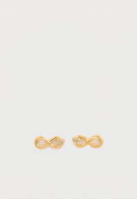 Χρυσά σκουλαρίκια σε σχήμα απείρου με τρεις μικρές διάφανες κρυστάλλινες πέτρες σε κάθε άκρη, με λεία μεταλλική υφή και γυαλιστερό φινίρισμα.