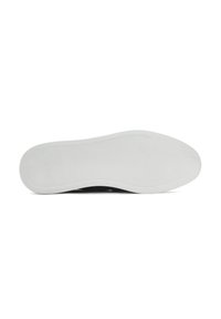 Black sneaker with a textured upper, featuring a white rubber outsole. The sole has ridges for grip and a smooth surface.
