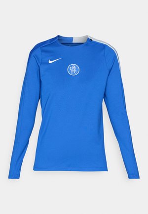 Langsleeve sporttrui in felblauw, gemaakt van gladde stof. Heeft een ronde halslijn, een wit Nike-logo en een FC-logo op de borst.