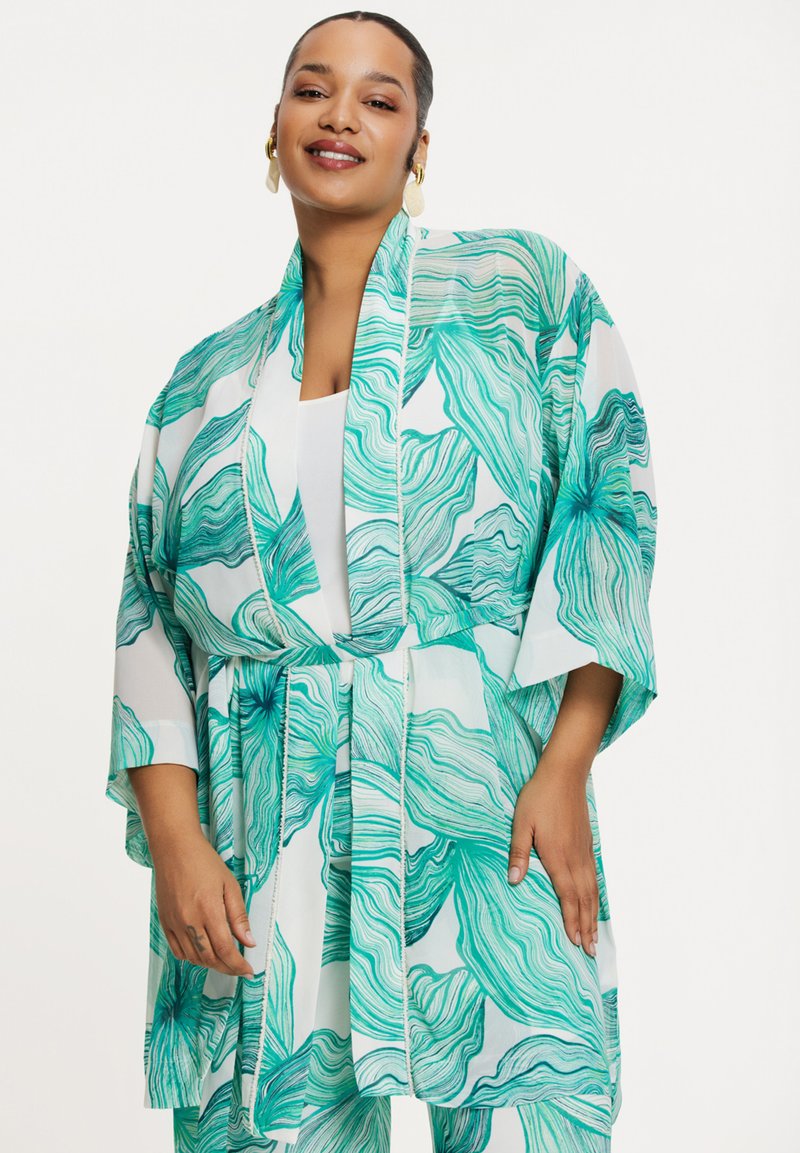 Kimonos in teal en witte golfpatroon, met een losse pasvorm, brede mouwen en een striksluiting voor veelzijdige styling.