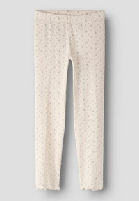 Kremowe prążkowane legginsy z małym różowym kwiatowym wzorem i falbanami na końcach, zaprojektowane dla dzieci.