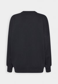 Felpa nera a maniche lunghe con polsini e orlo a coste, mostrata dal retro su uno sfondo chiaro e semplice.