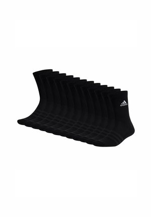 Calzini sportivi neri, materiale a coste, lunghezza caviglia, con logo Adidas in bianco. Set di più paia allineati in una fila.