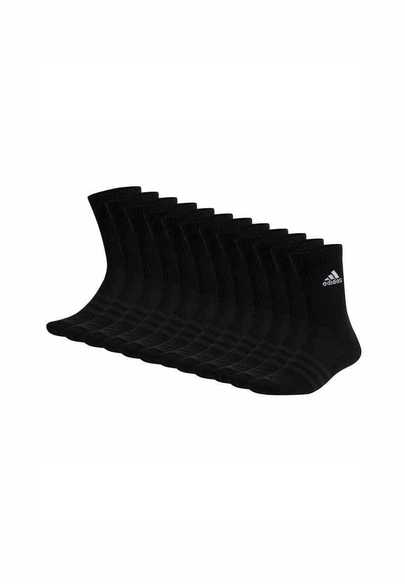 Chaussettes de sport noires, en matériau côtelé, longueur cheville, arborant le logo Adidas en blanc. Ensemble de plusieurs paires alignées en rang.