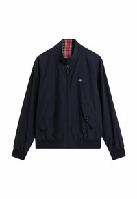 Giacca bomber blu navy con zip frontale, due tasche con bottone e rivestimento a quadri. Caratterizzata da orlo ed elastico ai polsi per un look aderente.