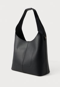 Black leather hobo bag with a smooth texture, wide shoulder strap, and subtle seam detailing. Features a relaxed, slouchy shape.