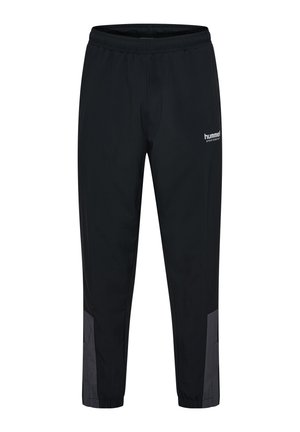 Černé sportovní kalhoty s elastickým pasem, šedé panely poblíž kotníků a logo "hummel" na horní části stehna.