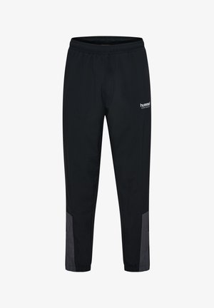 Sorte sportbukser med elastisk talje, grå paneler nær anklerne og "hummel" logo på den øverste lår.