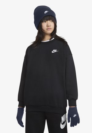 Black sweatshirt with a white Nike logo, paired with navy blue gloves and hat. Smooth fabric, loose fit, and contrasting color accents.
