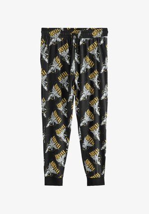 Pantaloni sportivi neri con un motivo ripetitivo che presenta angeli argentati e il testo giallo "NIRVANA". Vita elastica con design alla caviglia a elastico.