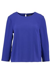 Blusa a maniche lunghe in tessuto blu brillante. Collo rotondo con dettaglio a chiave sulla schiena. Texture liscia, vestibilità rilassata e senza motivi visibili.