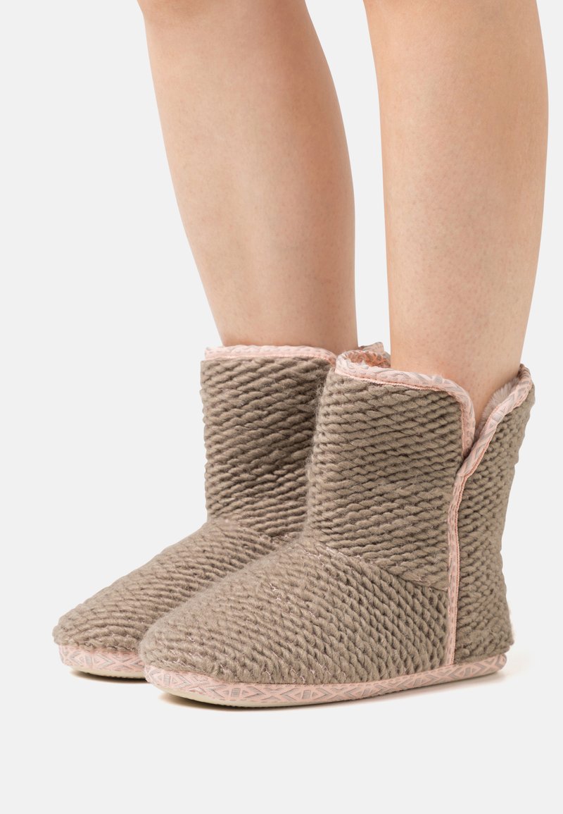 Gray textured booties with pink trim, featuring a cozy wool-like material and a flat, patterned sole for traction.