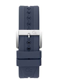 Bracciale in silicone blu navy con fibbia metallica argento. Presenta una superficie testurizzata e un logo impresso. Progettato per durata e comfort.