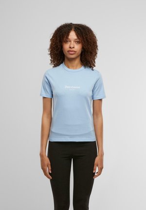 Light blue cotton t-shirt with a crew neck, short sleeves, and white "Juicy Couture Sport" logo on the front. Smooth texture.