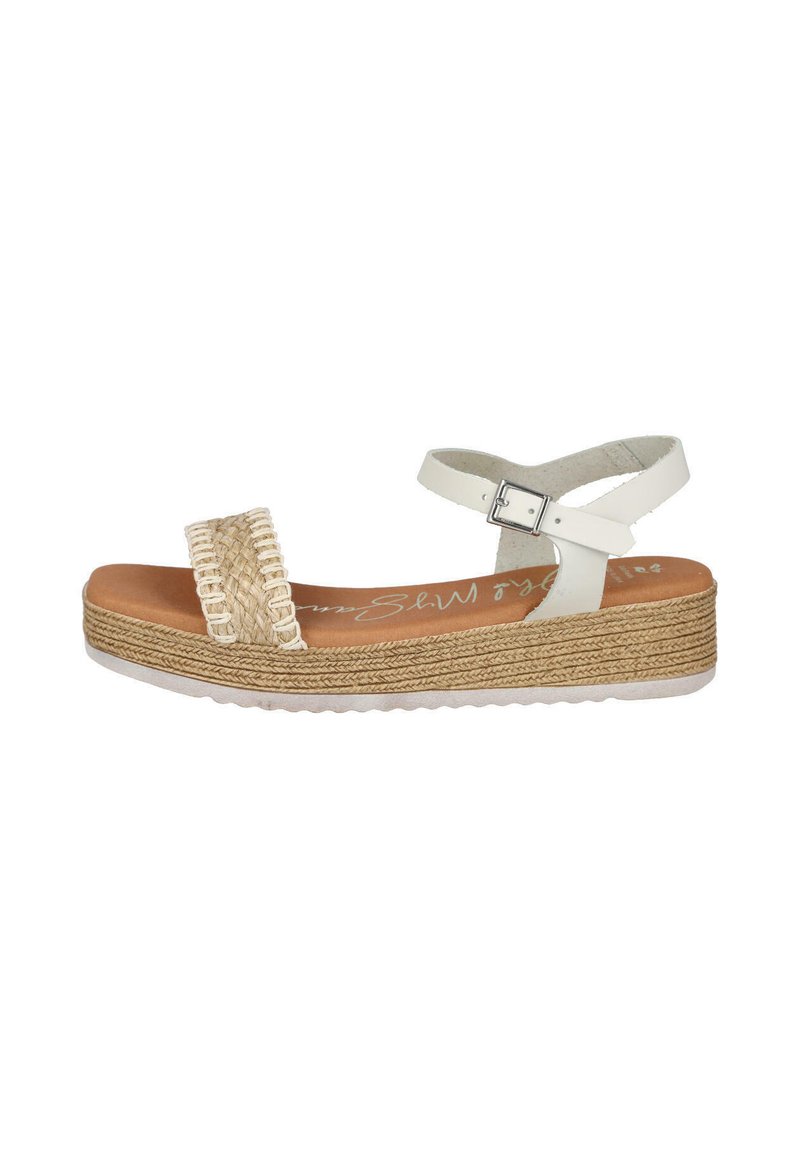Sandalia blanca con tira de yute trenzado, hebilla ajustable en el tobillo y suela texturizada en capas. La plantilla es de color beige con un sutil logotipo.