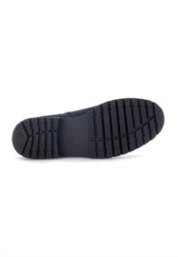 Suela de zapato de goma negra con un patrón texturizado y estriado para tracción, con "Gabor" estampado cerca del área del talón.