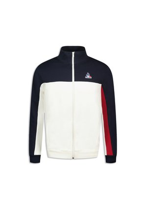 Zip-up jacket with a white body, navy sleeves, and red accents. Features a high collar and logo on the chest. Made from soft fabric.