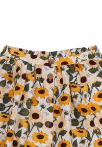 Floral skirt with a yellow sunflower pattern on a white background, featuring a gathered waistband and wooden buttons down the front.
