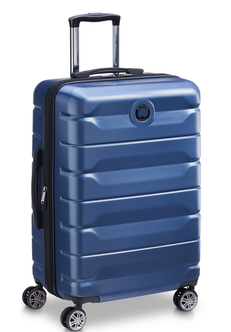 Hartschalenrollkoffer in tiefblau mit strukturierter Oberfläche, ausziehbarem Griff und vier Spinner-Rädern. Verfügt über einen Reißverschluss.
