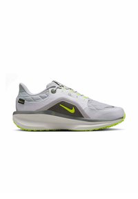 Scarpa da corsa grigia con tomaia testurizzata, dettagli verde neon, suola ammortizzata e design leggero e traspirante. Caratterizzata da un'area della punta rinforzata.