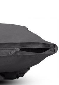 Gray fabric bag with a smooth texture, featuring a zippered top and rounded shape, designed for easy access and portability.
