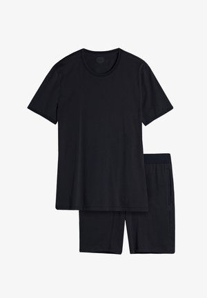Camiseta de algodón negra con cuello redondo y mangas cortas, combinada con pantalones cortos a juego que cuentan con una cinturilla elástica y bolsillos laterales.